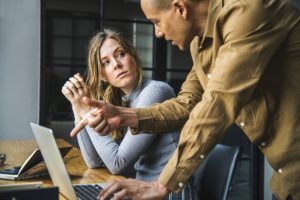 Business coach providing advice in a one-to-one coaching session